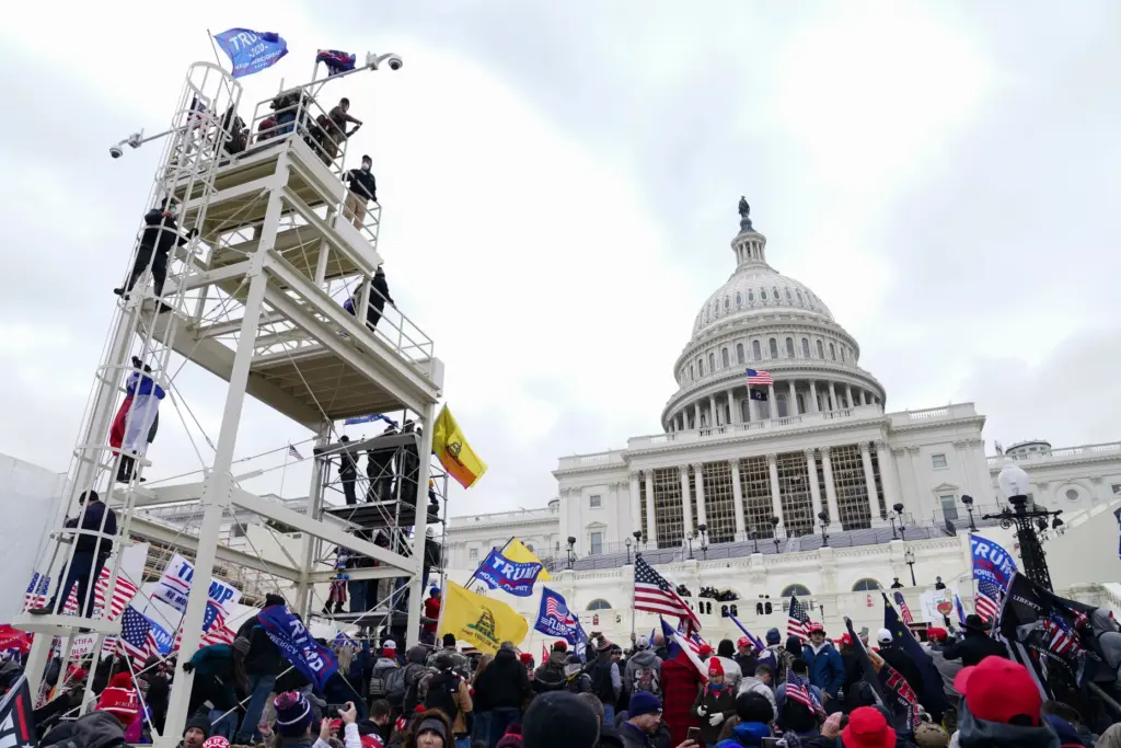 FILE – Trump supporters gather outside the Capitol, Jan. 6,...