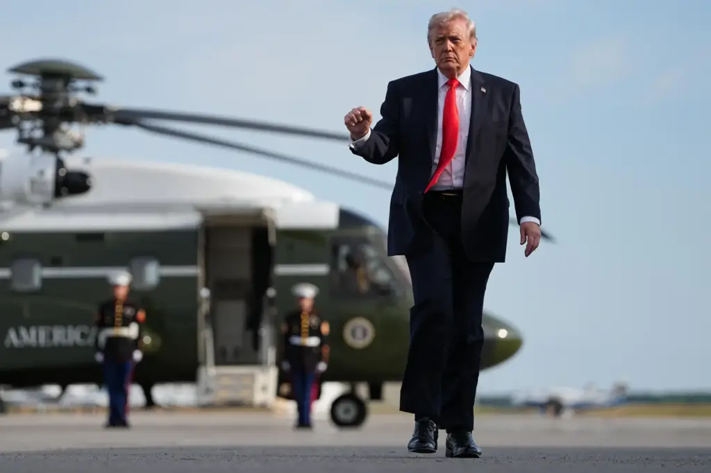 President Donald Trump walks from Marine One to board Air Force One.