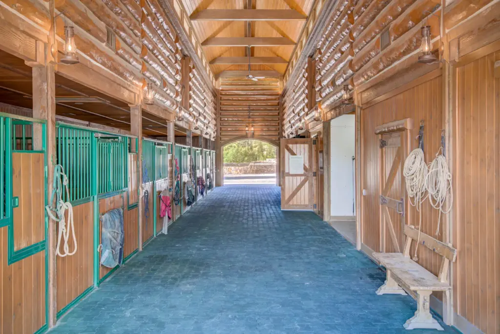 An interior image of Triple Creek Ranchâs equestrian facilities near...