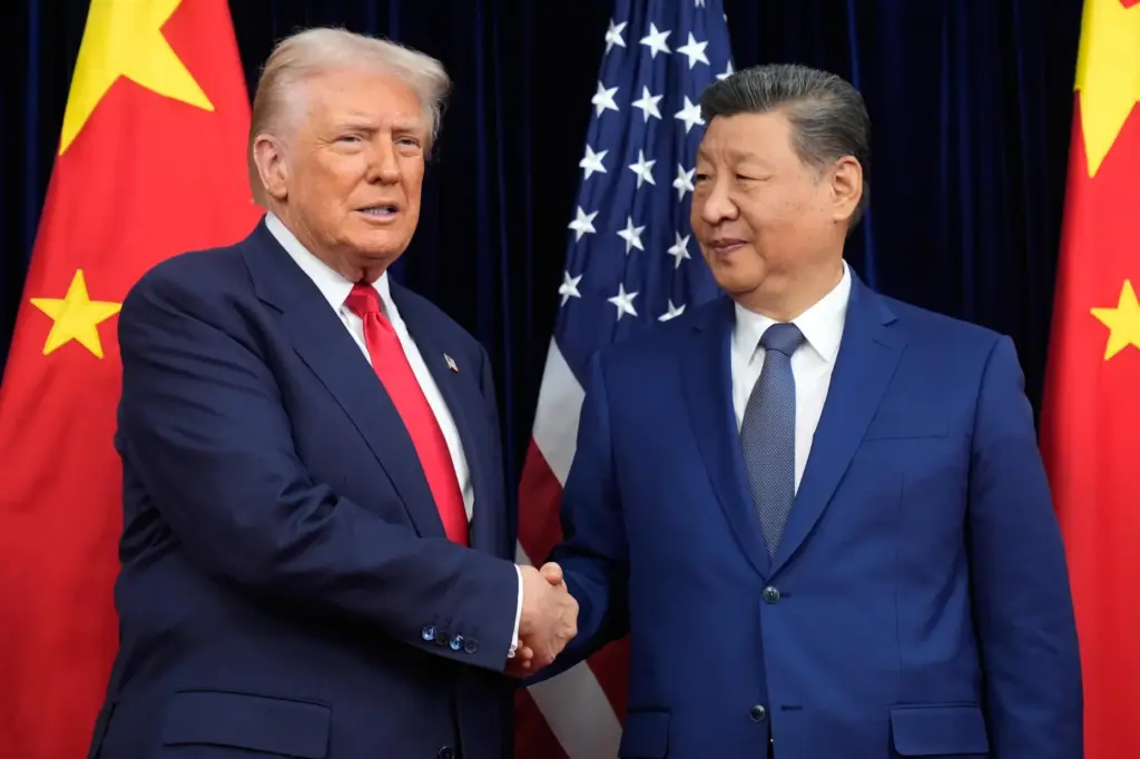 President Donald Trump shakes hands with Chinese President Xi Jinping.