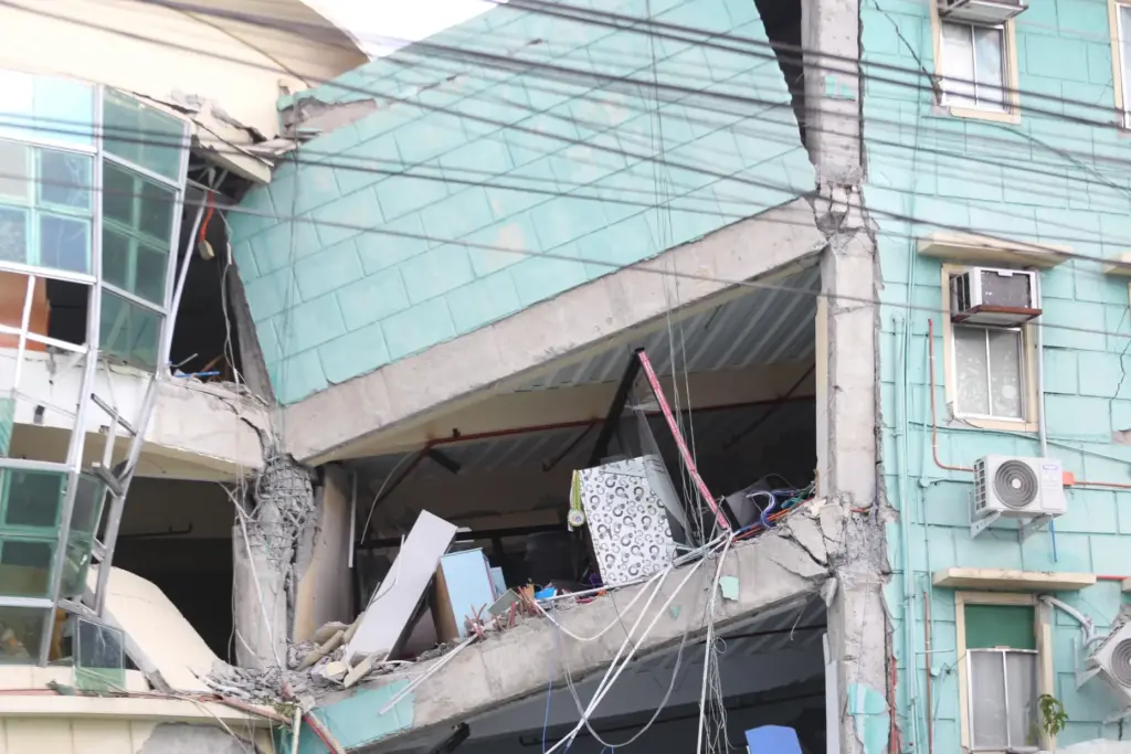 A building is damaged after an earthquake in General Santos,...