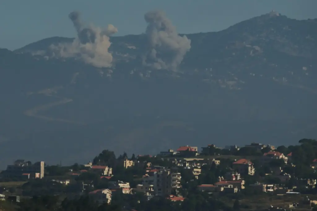 Smokes rise to the sky following an Israeli military strike...