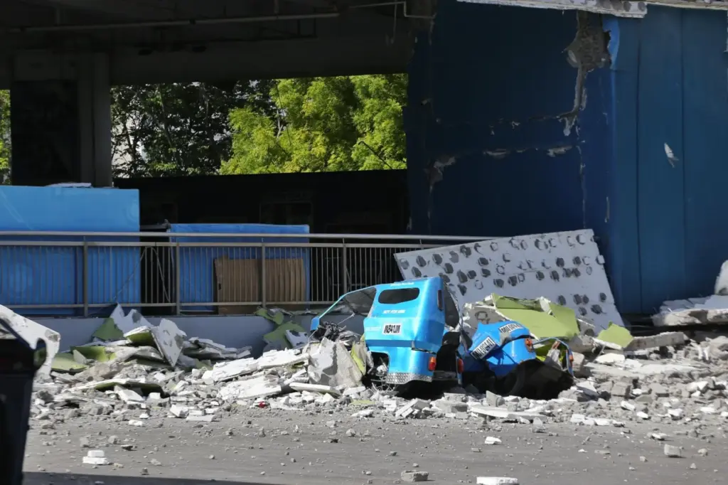 Debris lies on a road after an earthquake in General...
