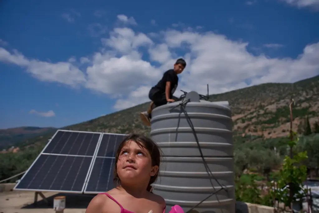 A girl looks toward what residents said was an Israeli...