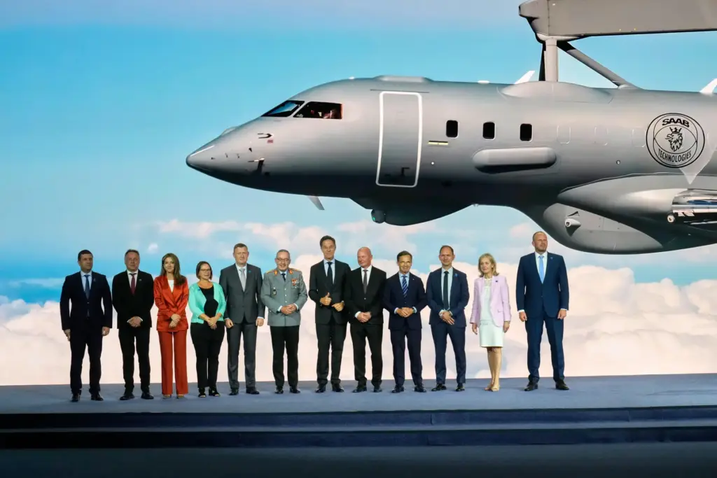 NATO Secretary General Mark Rutte poses with defense ministers and industry representatives.