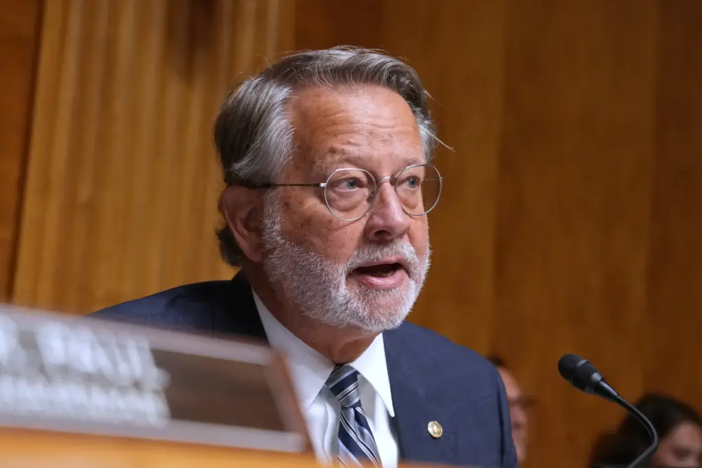 Sen. Gary Peters, D-Mich., speaks as Dr. Anthony Fauci appears before a Senate committee.