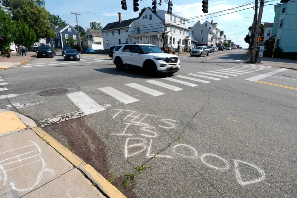 Blood is seen on the pavement near the scene of...