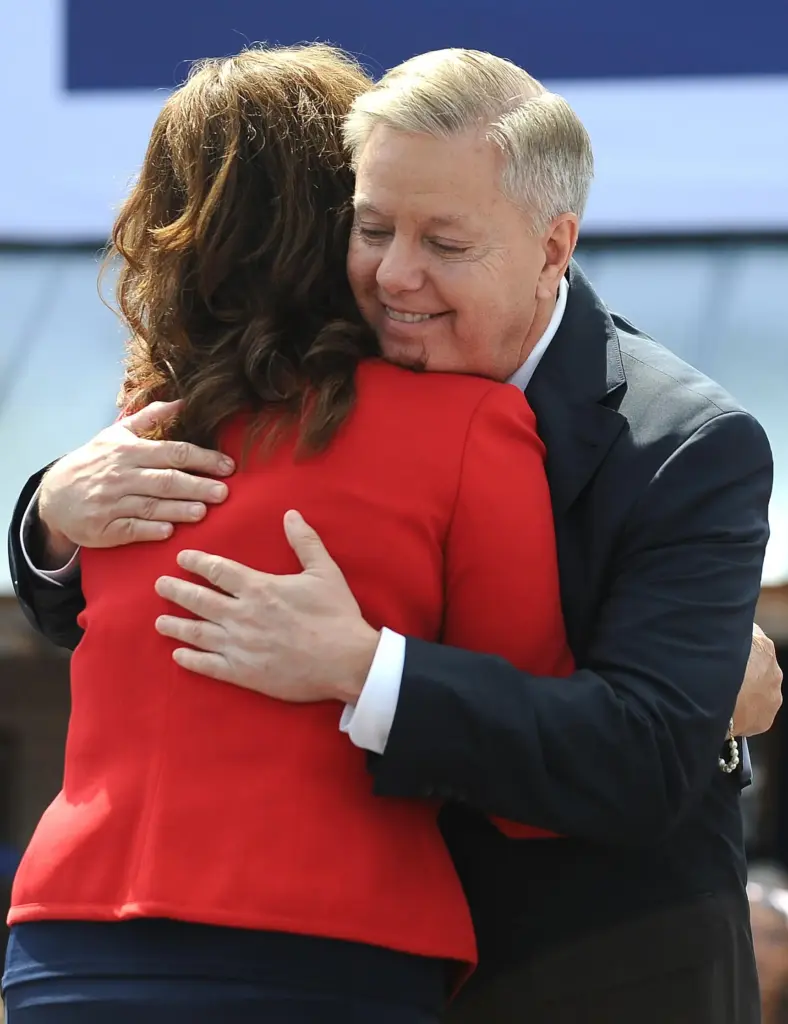 FILE – Sen. Lindsey Graham, R-S.C., right, hugs his sister...