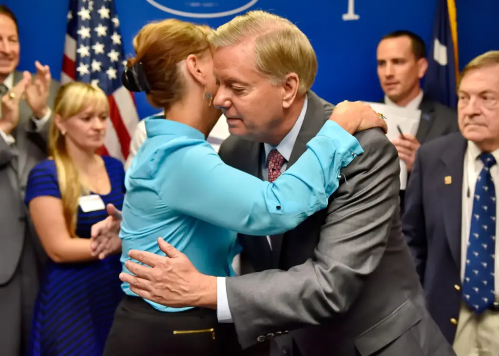 FILE – Republican presidential candidate, Sen. Lindsey Graham, R-S.C., right,...