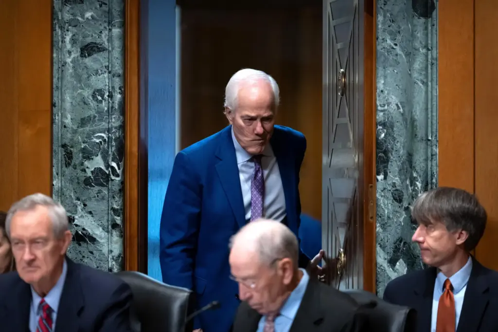Sen. John Cornyn, R-Texas, arrives for a hearing of the Senate Finance Committee.