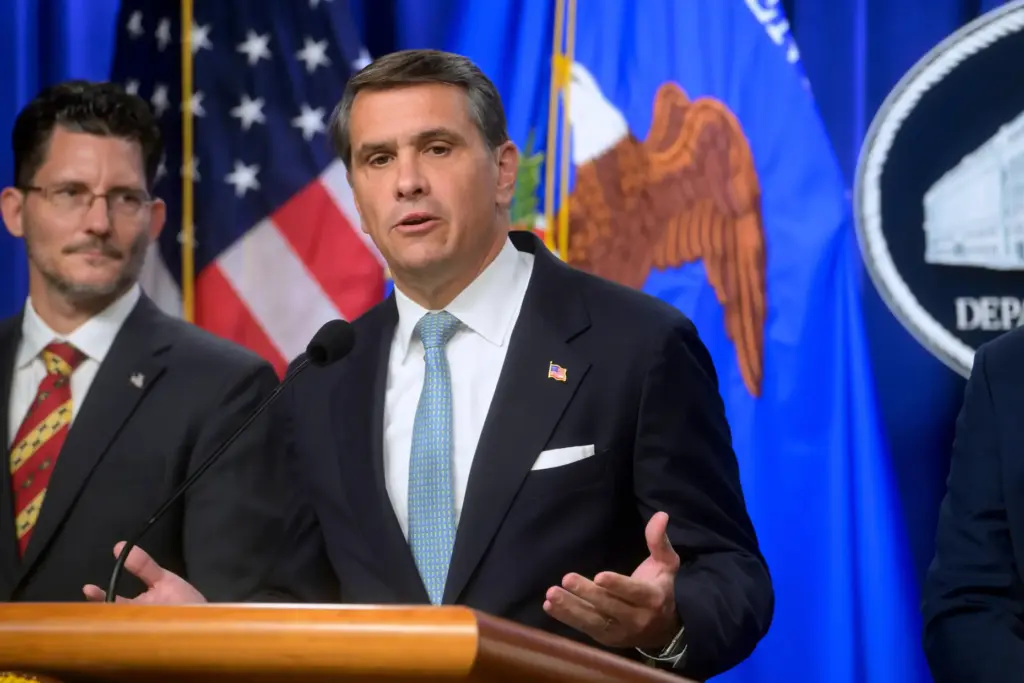 Acting Attorney General Todd Blanche speaks during a news conference.