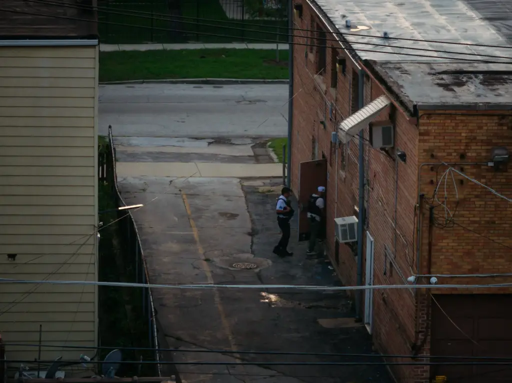 Chicago police enter the South Chicago Chapel funeral home where...