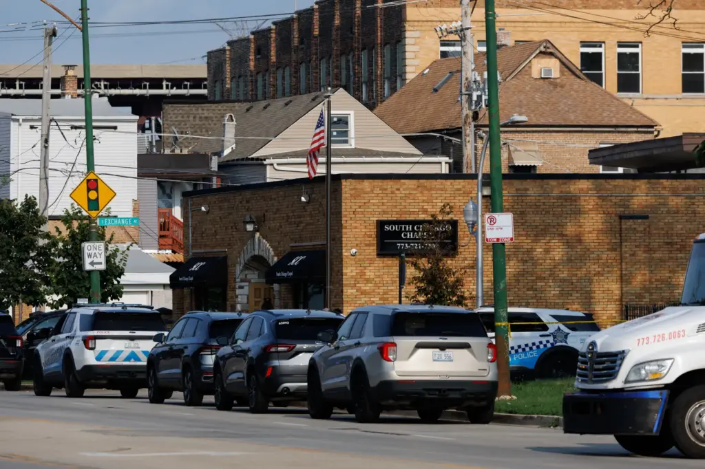 Chicago police work the scene where dozens of bodies were...