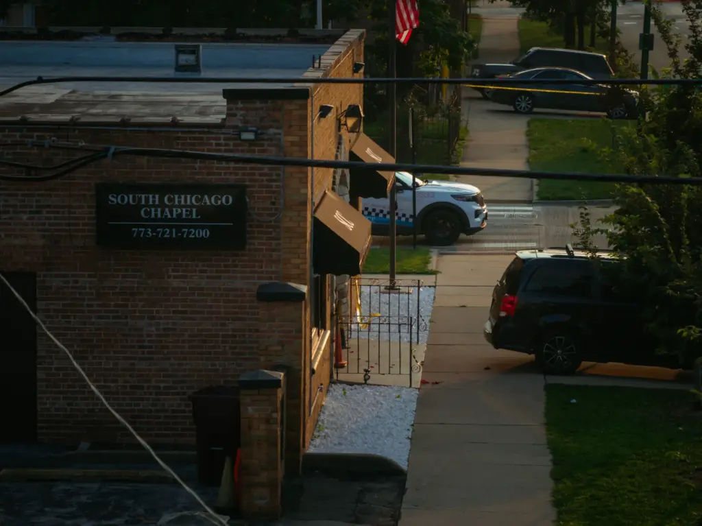 Officials work outside South Chicago Chapel funeral home where dozens...
