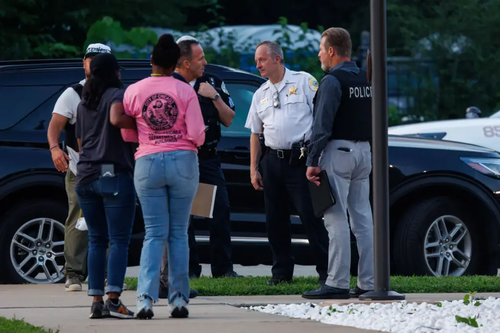 Chicago police and city officials work outside South Chicago Chapel...