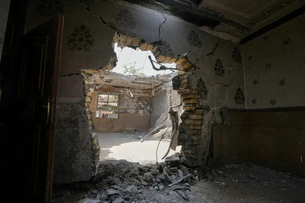 A hole on a wall is seen inside a home...