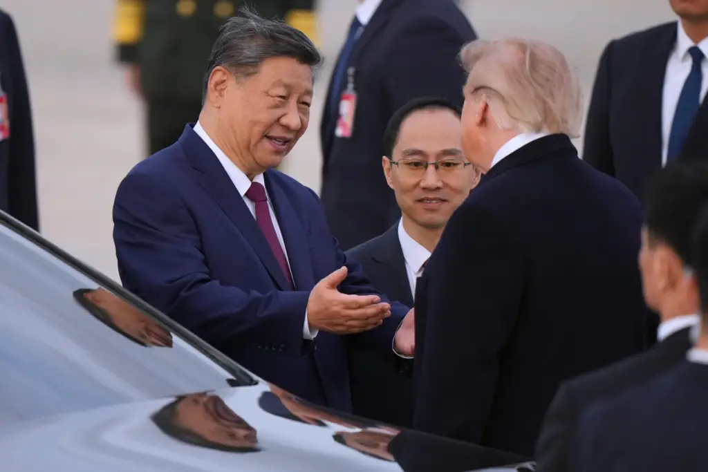 President Donald Trump and Chinese President Xi Jinping talk together.
