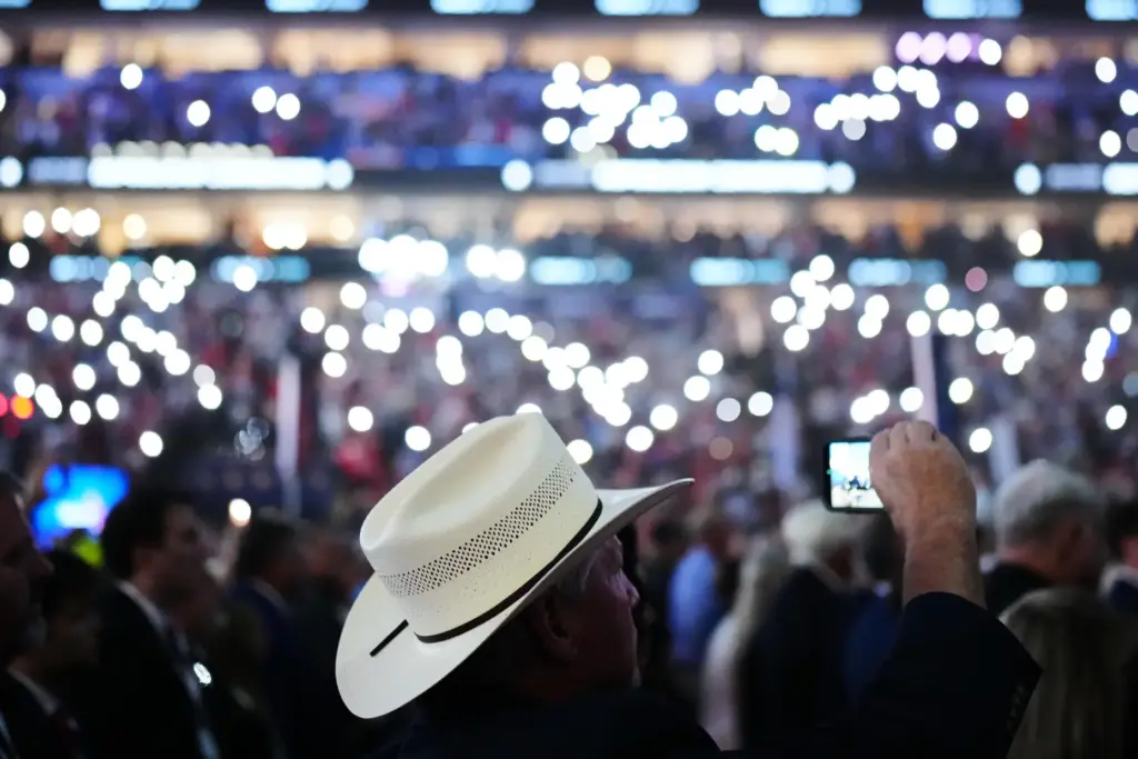 People stand as victims and first responders from Sept. 11 are honored at the Republican convention.