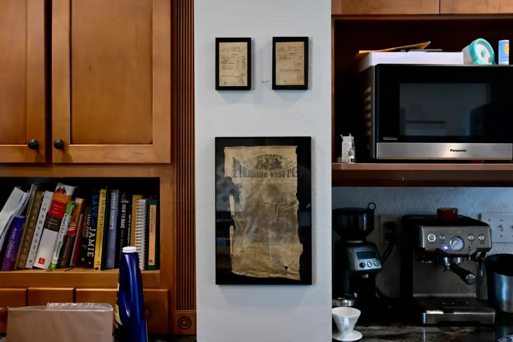 Items from the home are framed in Kelley’s kitchen. (Joel...