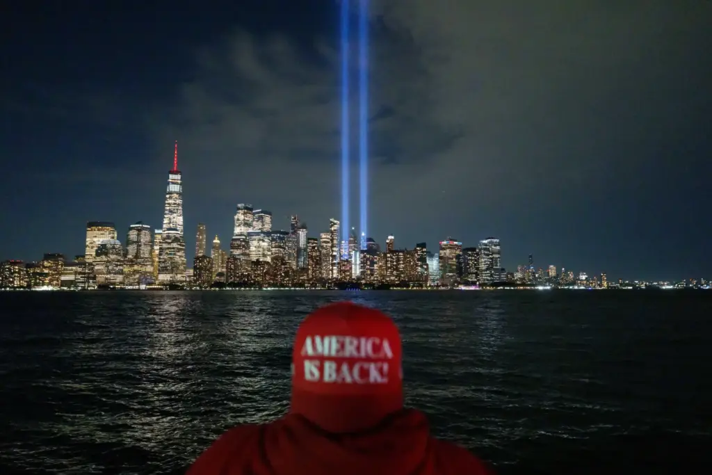Phillip Flood watches as the Tribute in Light is tested over the skyline of lower Manhattan.
