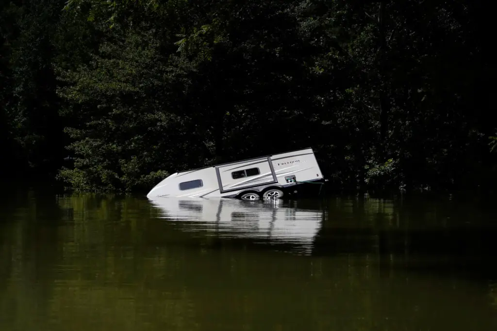 A camper is partly submerged underwater in Carr Creek Lake in Kentucky.