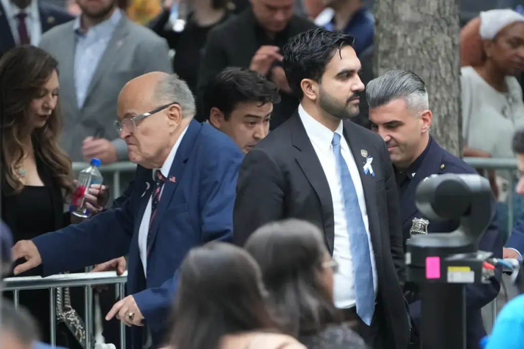 New York Mayor Zohran Mamdani passes former New York Mayor Rudy Giuliani.