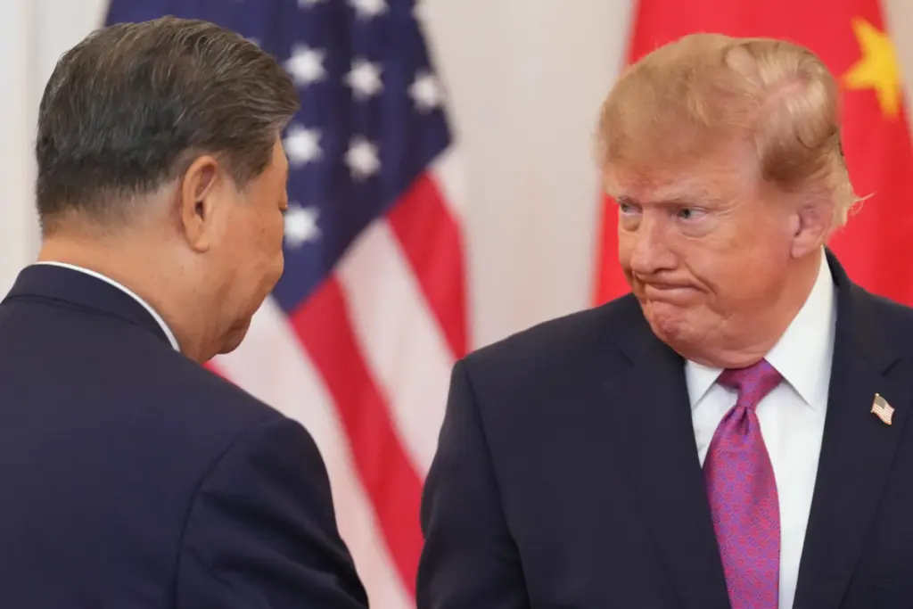President Donald Trump shakes hands with China’s President Xi Jinping...