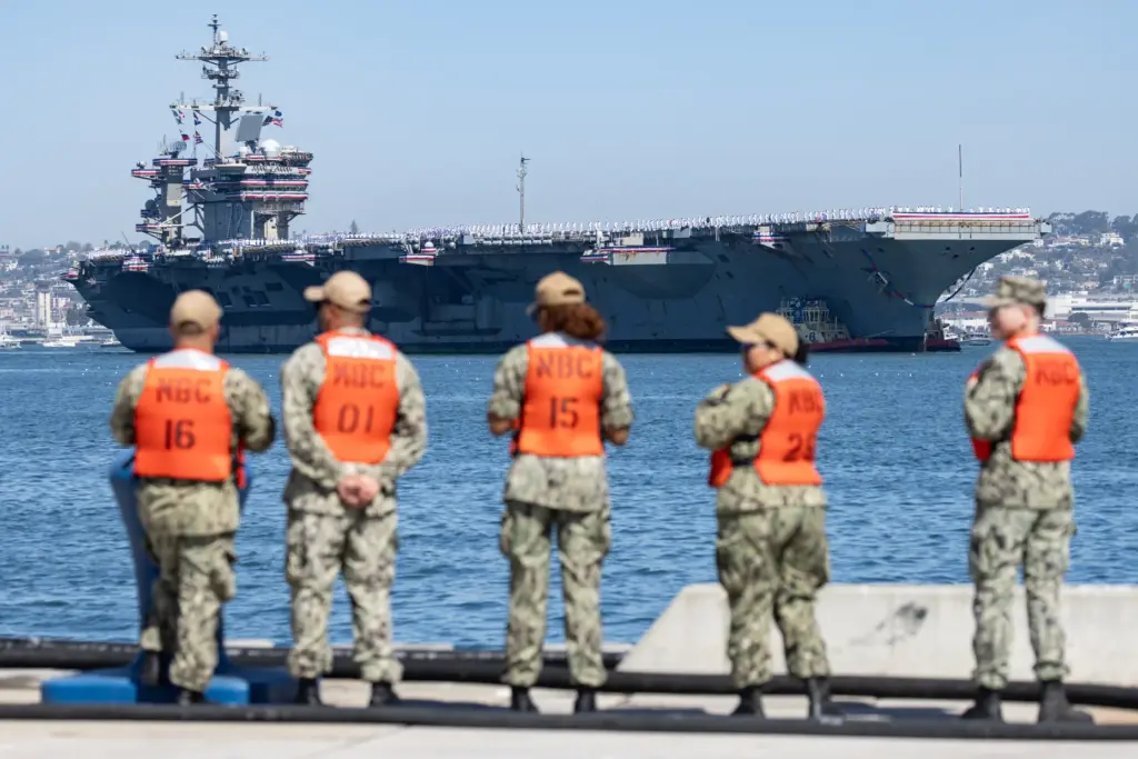 Coronado, CA – Sailors wait on Pier Lima as the...
