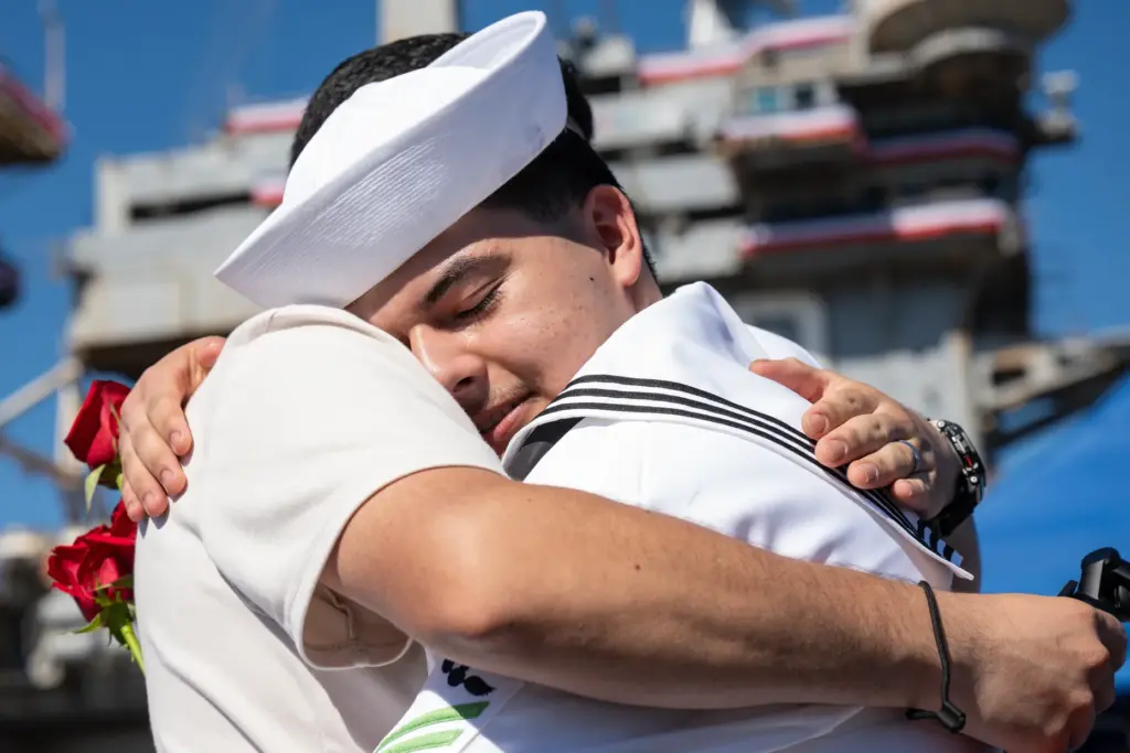 Coronado, CA – Sailor Jorge Perez hugs his brother Michael...