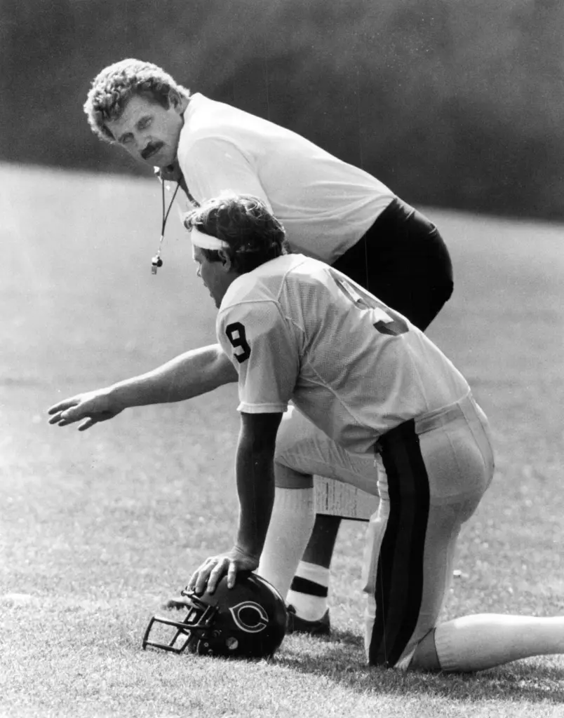 Bears coach Mike Ditka and quarterback Jim McMahon go over...