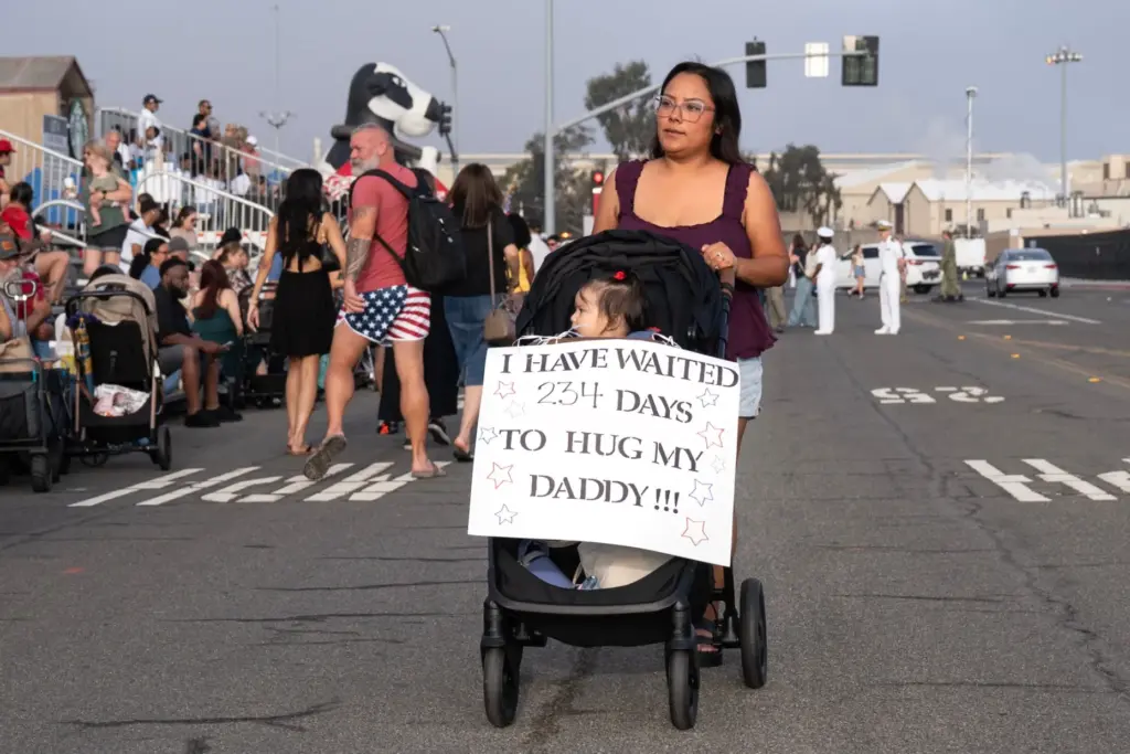 Brenda Rivas pushes her 7-month-old daughter Evie Rivas in a...